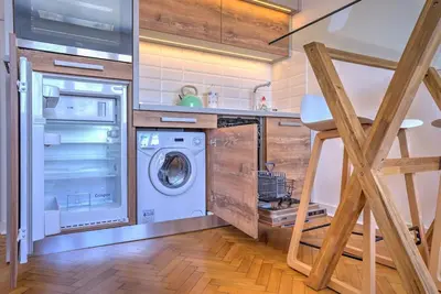 a laundry room with a washer and dryer at Belgrade Central Apartment in Belgrade