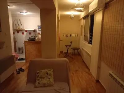a living room with a couch and a table at Top Studio in Belgrade