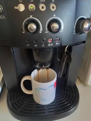 a coffee maker is making a cup of coffee at Top Studio in Belgrade