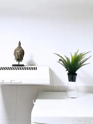 a white piano with a plant on top of it at Fully Equipped - Cozy & Convenient City Apartment in Belgrade