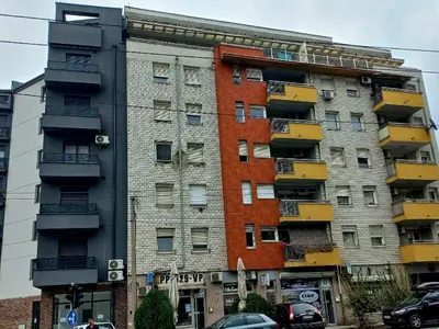 a tall building with balconies on the side of it at Urban Nest - Orange in Belgrade