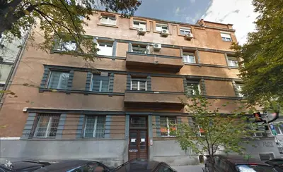 a large brick building with a lot of windows at Dorcol - the Heart of Belgrade in Belgrade