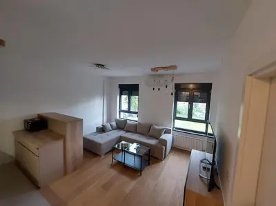 a living room with a couch and a table at Viskra in Belgrade