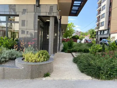 a walkway in front of a building with plants at Viskra in Belgrade