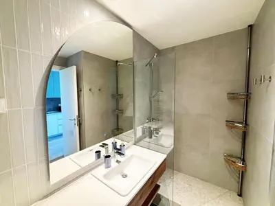 a bathroom with a sink and a mirror at Belgrade Waterfront-Beograd na vodi Galaxy Apartment in Belgrade