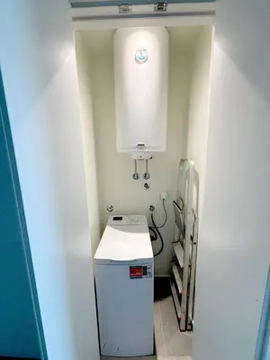 a small kitchen with a sink and a white cabinet at Belgrade Waterfront-Beograd na vodi Galaxy Apartment in Belgrade