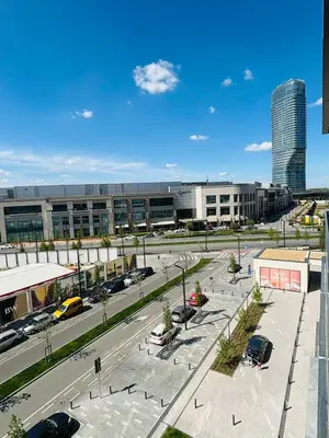 an aerial view of a parking lot in a city at Belgrade Waterfront-Beograd na vodi Galaxy Apartment in Belgrade