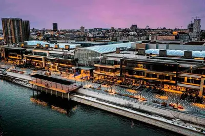 a large building next to a body of water at Belgrade Waterfront-Beograd na vodi Galaxy Apartment in Belgrade