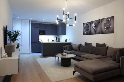 a living room with a couch and a table at Cityheart St. Sava in Vračar (historical)