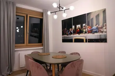a dining room with a table and chairs at Cityheart St. Sava in Vračar (historical)