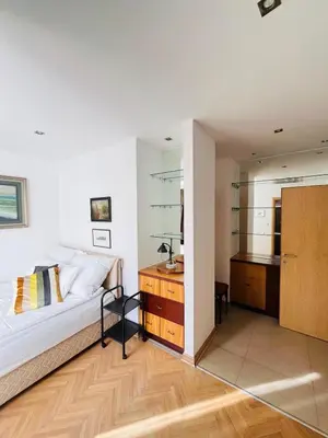 a bedroom with a bed and a desk at St. Mark in Belgrade