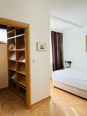 a bedroom with a bed and a closet at St. Mark in Belgrade