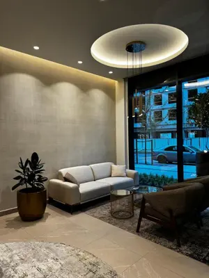 a living room with a couch and a table at Belgrade Waterfront - Beograd na vodi Scala in Belgrade