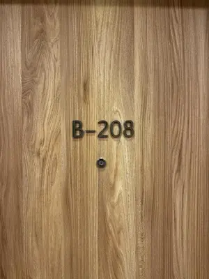 a wooden door with the number on it at Belgrade Waterfront - Beograd na vodi Scala in Belgrade
