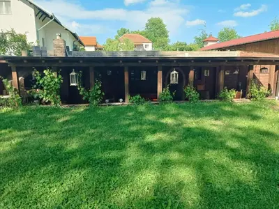 a house with a lawn in front of it at Jablanicki Refugium in Pružatovac