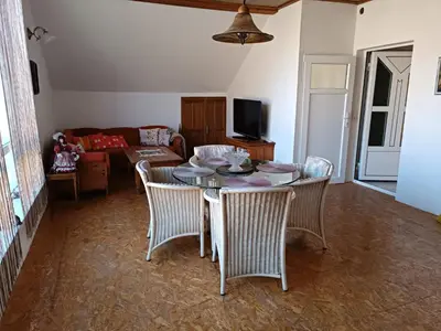 a living room with a table and chairs and a couch at Jablanicki Refugium in Pružatovac