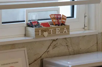 a shelf with a box of snacks on a window sill at AIRPORT APARTMANI HAPPY HOUSE free parking & early check-in in Surčin