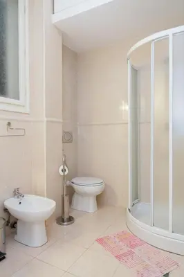 a bathroom with a toilet and a shower and a sink at Central Belgrade Apartment 2 in Belgrade