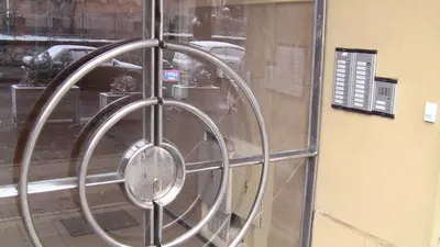 a metal circle is on the side of a window at Slavija Square Apartment Cvetni Trg in Belgrade
