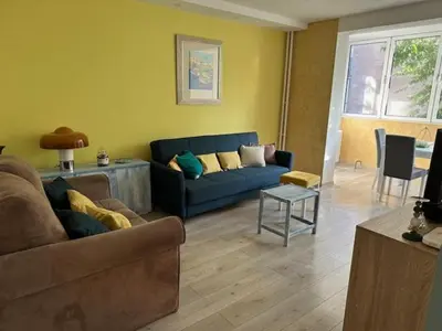 a living room with a couch and a table at Modern one bedroom in the center of Belgrade in Belgrade