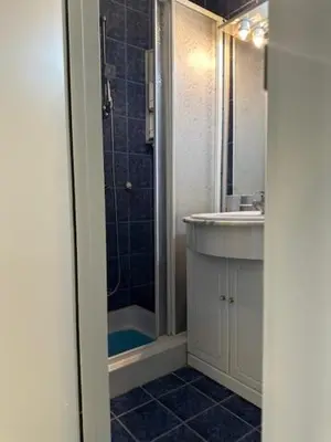 a bathroom with a sink and a shower at Modern one bedroom in the center of Belgrade in Belgrade
