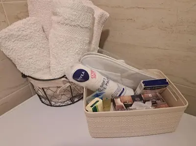 a basket with toothbrushes and other items in it at Cozy lux bedroom apt with balcony in Dorcol in Belgrade