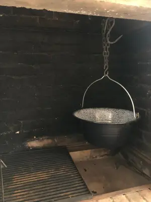 a metal bucket in a black room with a chain at Blue apartman in Belgrade