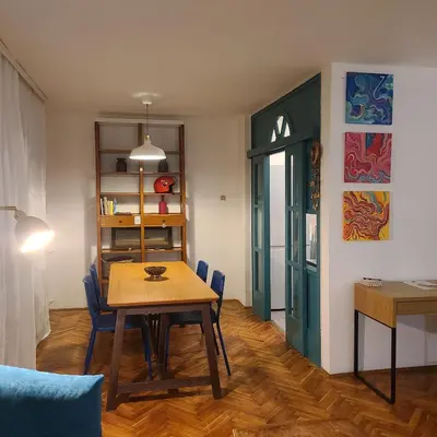 a dining room with a table and chairs at Soulful Apartment Belgrade in Belgrade