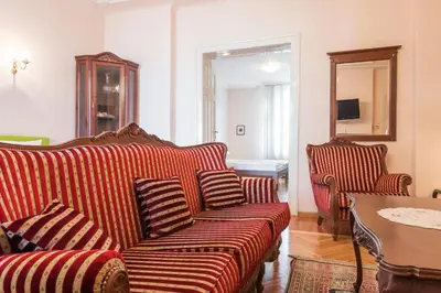 a living room with a couch and a table at Central Belgrade Apartments 1 in Belgrade