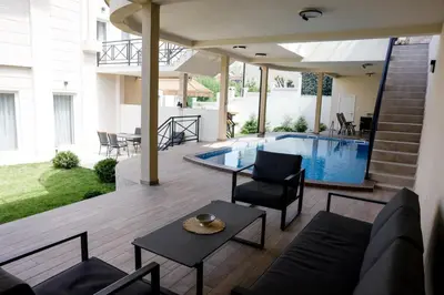 a living room with a pool in a house at Villa Vanja Belgrade in Belgrade