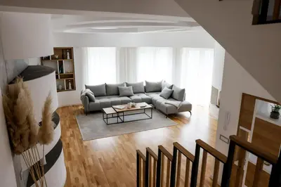 a living room with a couch and a table at Villa Vanja Belgrade in Belgrade
