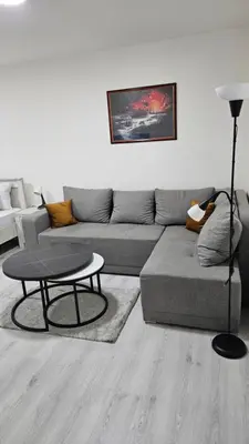 a living room with a couch and a table at Apartman Pavlovic 2 in Dušanovac (historical)
