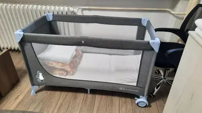 a baby cart sitting on the floor next to a desk at Apartman Pavlovic 2 in Dušanovac (historical)
