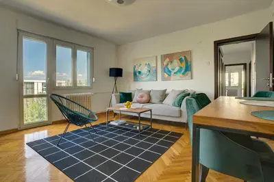 a living room with a couch and a table at City View in Dušanovac (historical)