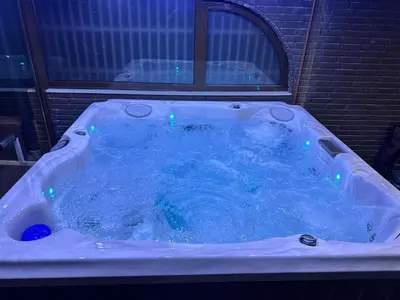 a jacuzzi tub with blue lights in it at Belgrade River House in Belgrade
