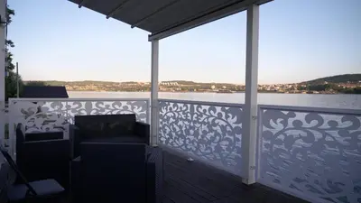 a balcony with a view of the water at Belgrade River House in Belgrade