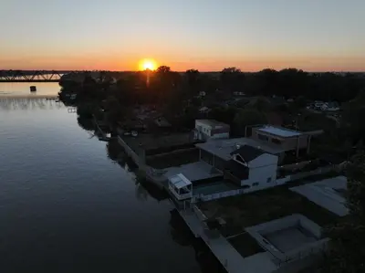 an aerial view of a river with the sunset at Belgrade River House in Belgrade