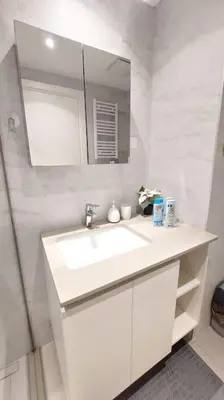 a white bathroom with a sink and a mirror at BW Central View - Belgrade Waterfront in Belgrade