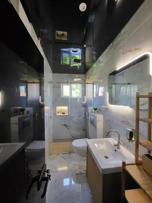 a bathroom with a sink and a toilet and a tub at Luxury Central Square Apartment 2214 in Belgrade