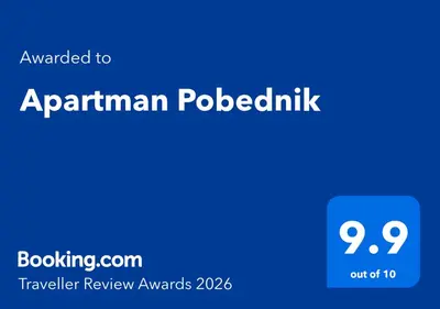 a blue sign with the words explained to appannian poodleiki at Apartman Pobednik in Belgrade