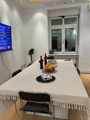 a table with a plate of fruit on it at Life & Work in Belgrade Centre with FREE parking! in Belgrade