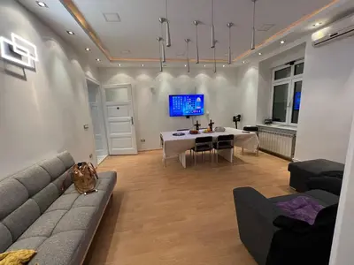 a living room with a couch and a table at Life & Work in Belgrade Centre with FREE parking! in Belgrade