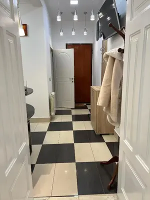 a bathroom with a black and white checkered floor at Life & Work in Belgrade Centre with FREE parking! in Belgrade