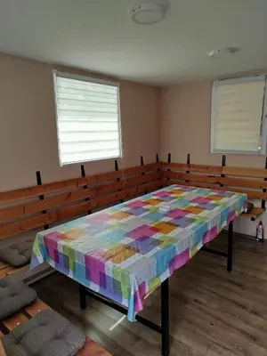 a bedroom with a colorful quilt on a bed at Splav na dan AXA in Barič