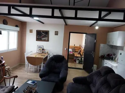 a living room with two couches and a table at Splav na dan AXA in Barič
