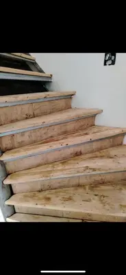 a set of wooden stairs with wooden treads at IDILA SPA New Belgrade in Novi Beograd