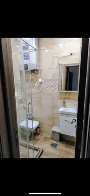 a bathroom with a shower and a toilet and a sink at IDILA SPA New Belgrade in Novi Beograd