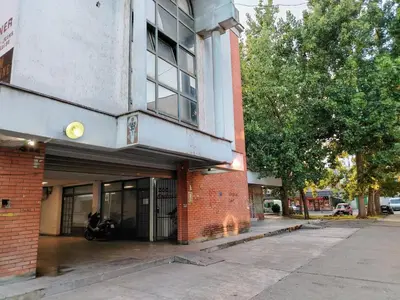a building on a street with a motorcycle parked outside at IDILA SPA New Belgrade in Novi Beograd