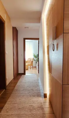 a hallway with a door leading to a living room at Medison in Belgrade