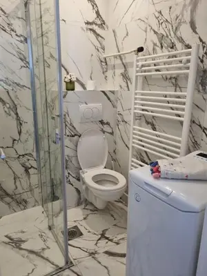 a bathroom with a toilet and a glass shower at Jela in Belgrade